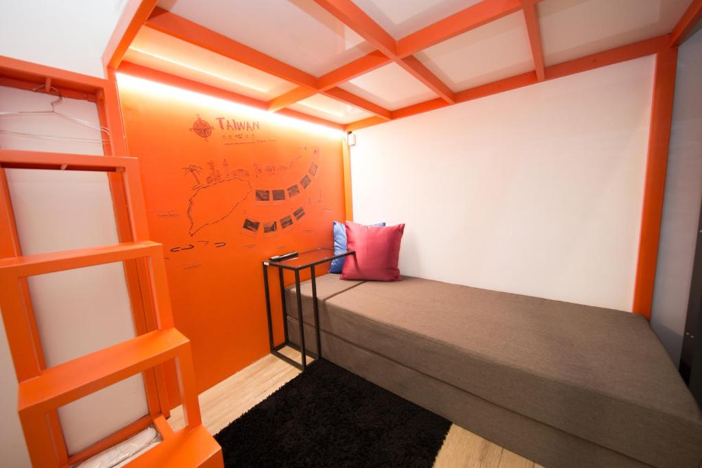 Ένα ή περισσότερα κρεβάτια σε δωμάτιο στο SleepBox Hostel