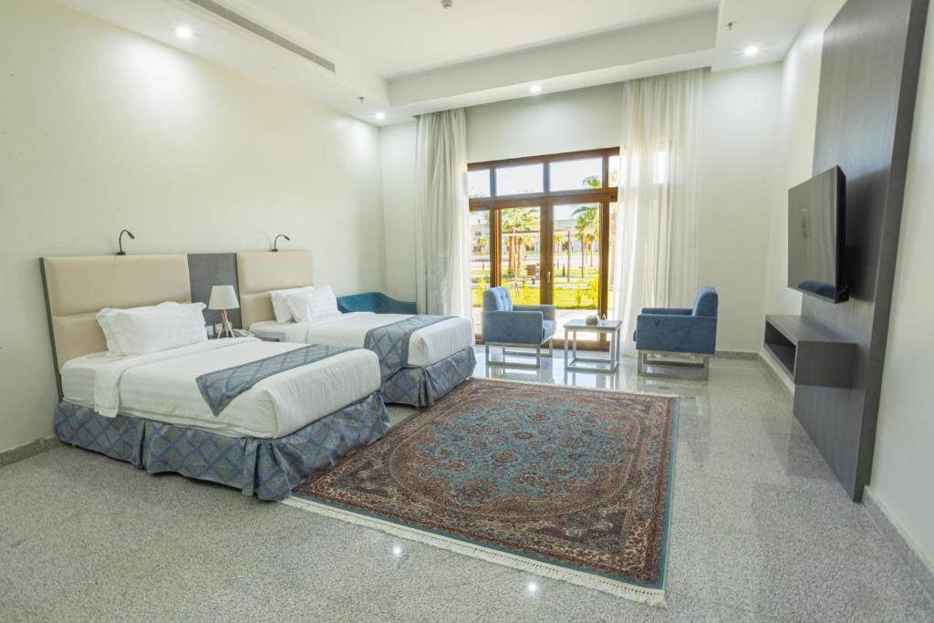 Postel nebo postele na pokoji v ubytování Vista Hotel Tabuk