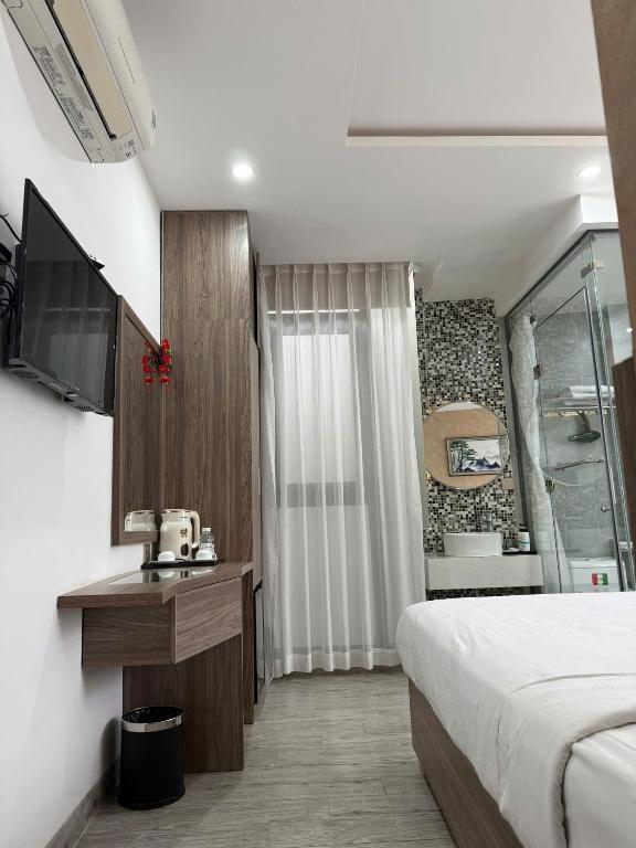 Giường trong phòng chung tại Angel Hotel