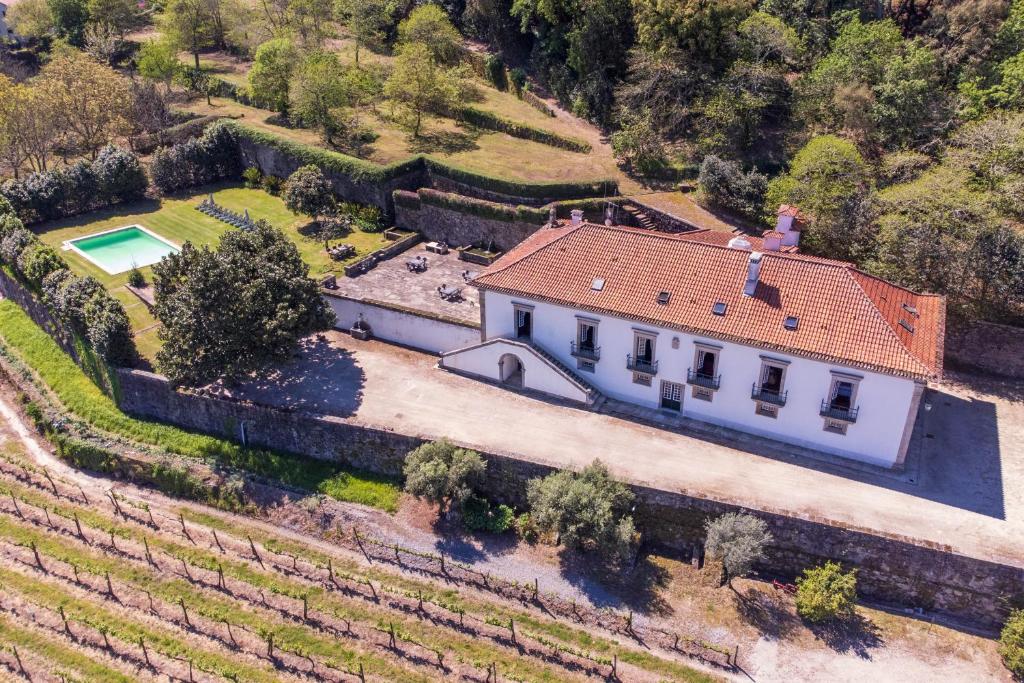 an aerial view of a house in a vineyard at Casa de Vilela - casa senhorial exclusiva perto do Porto para até 15 pessoas in Santo Tirso