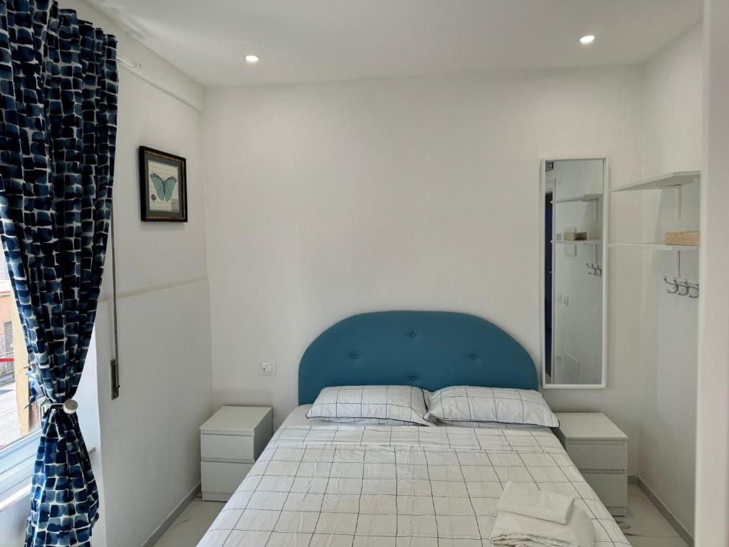 Postel nebo postele na pokoji v ubytování Iris Affitacamera