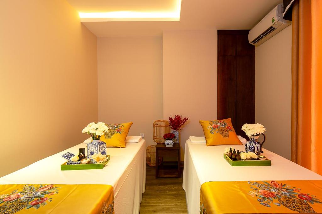 Postel nebo postele na pokoji v ubytování TGT BEACH HOTEL