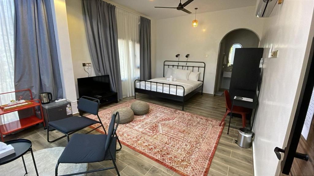 Postel nebo postele na pokoji v ubytování Roghan Hospitality Inn