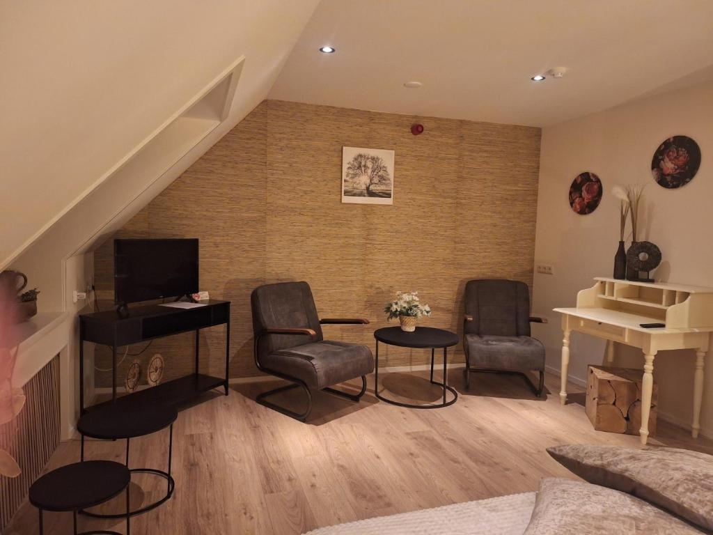 TV a/nebo společenská místnost v ubytování Hoeve Montigny B&B