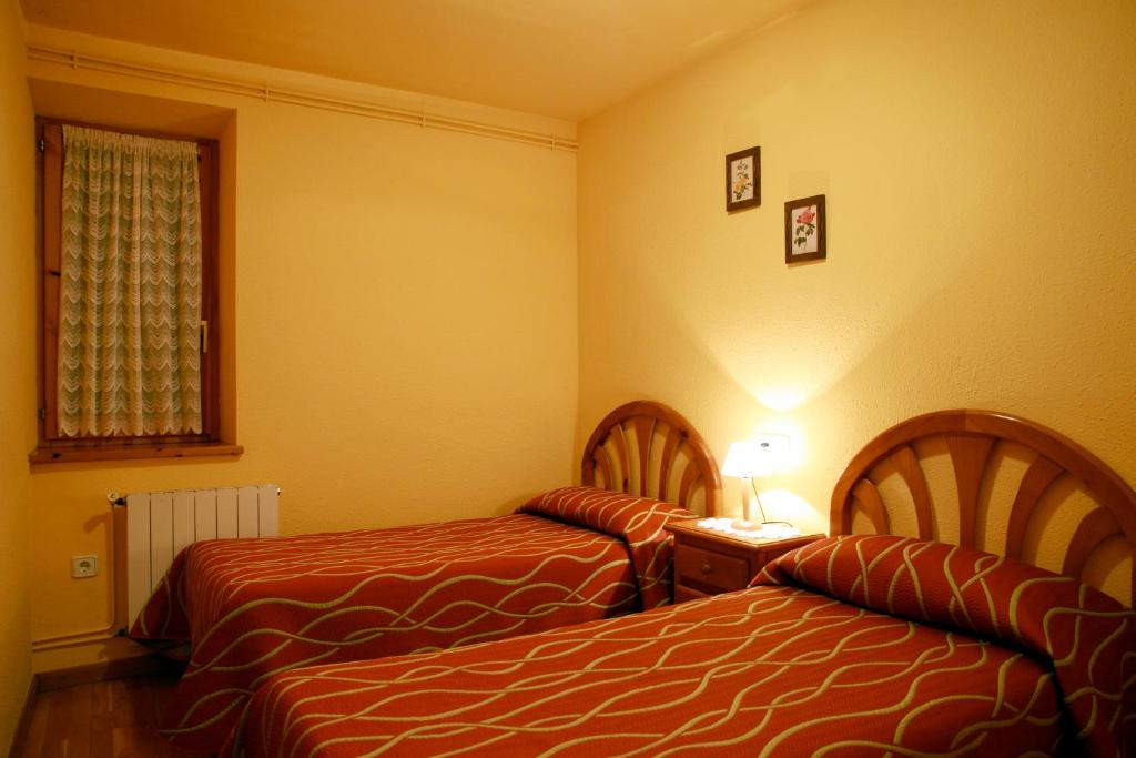 Postel nebo postele na pokoji v ubytování Apartaments La Llucana
