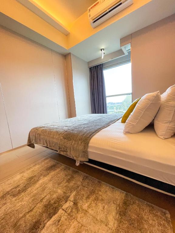 Postel nebo postele na pokoji v ubytování Bayshore Resort Residences - Okada Manila