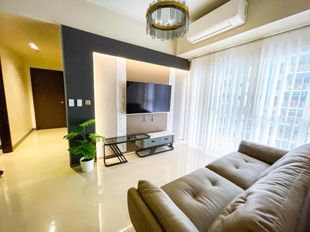 TV a/nebo společenská místnost v ubytování Bayshore Resort Residences - Okada Manila