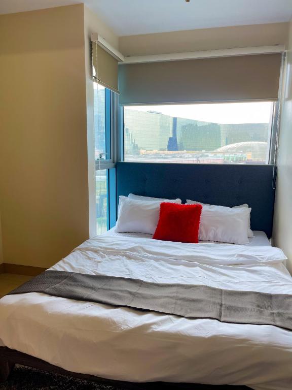 Postel nebo postele na pokoji v ubytování Bayshore Resort Residences - Okada Manila
