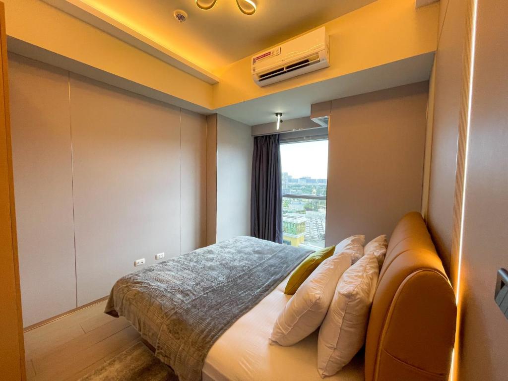 Postel nebo postele na pokoji v ubytování Bayshore Resort Residences - Okada Manila