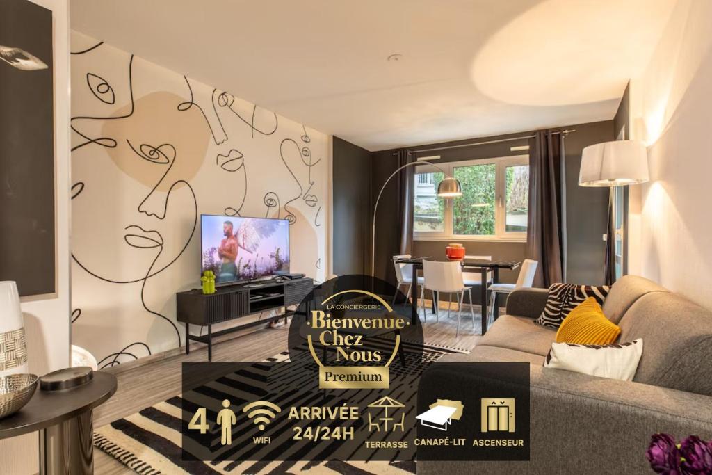 a living room with a couch and a tv at F2 "Paris Jaude " Clermont Fd in Clermont-Ferrand