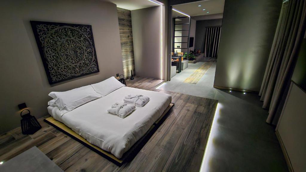 Postel nebo postele na pokoji v ubytování Agarthi Suites - Valtellina