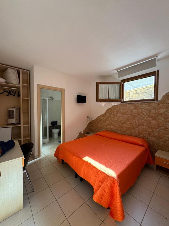 Postel nebo postele na pokoji v ubytování Sa Mamma e Sole B&B