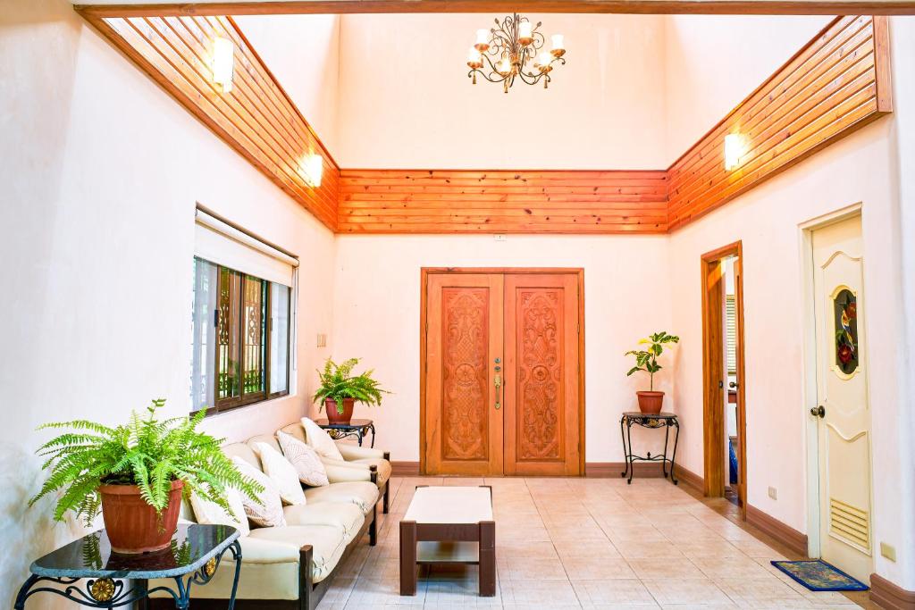 a living room with a couch and a table at La Veranda Tagaytay in Tagaytay