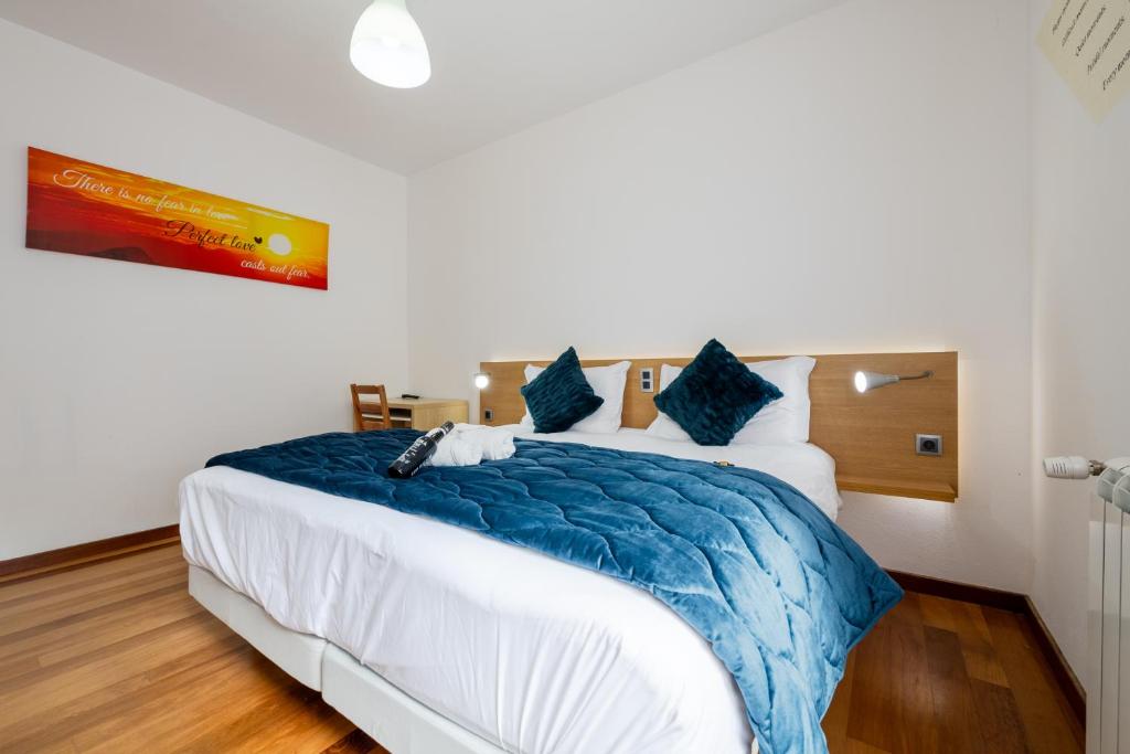 Postel nebo postele na pokoji v ubytování Casa Os Manos