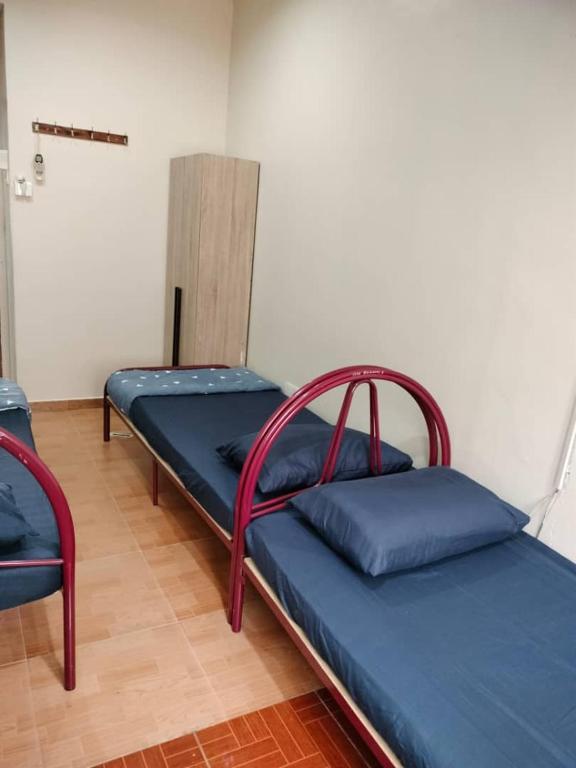 Postel nebo postele na pokoji v ubytování Beyond Homestay, Shah Alam
