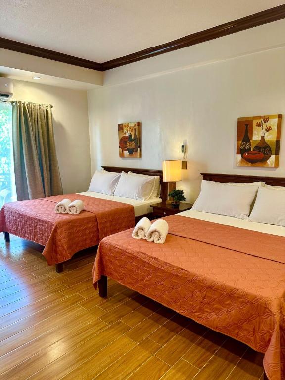 Postel nebo postele na pokoji v ubytování Club Balai Isabel Taal Lakeview 305 Malvar