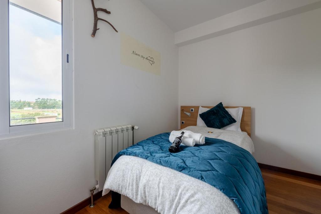 Postel nebo postele na pokoji v ubytování Casa Os Manos