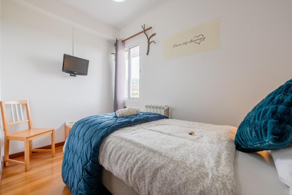 Postel nebo postele na pokoji v ubytování Casa Os Manos