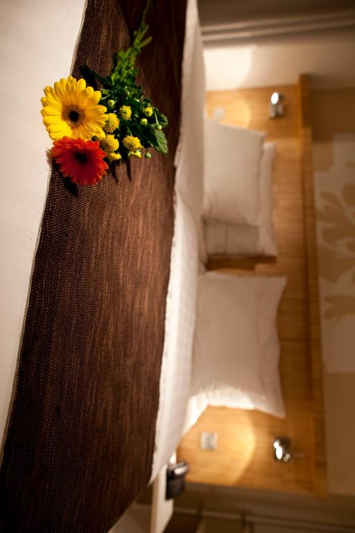 Postel nebo postele na pokoji v ubytování Dahlia Inn