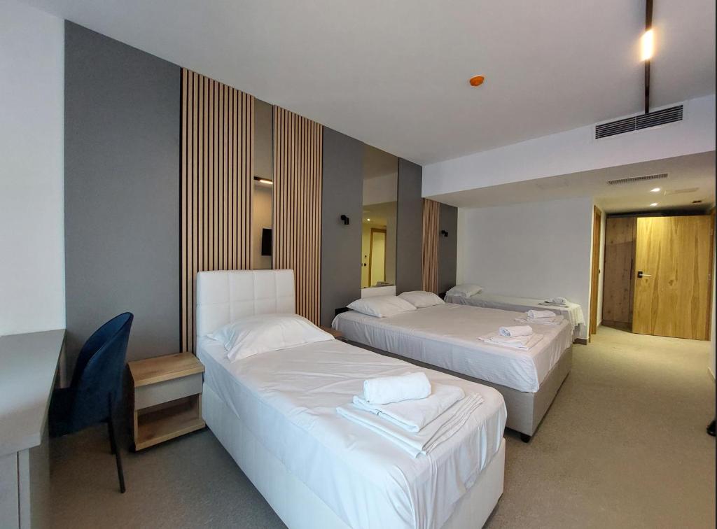 Postel nebo postele na pokoji v ubytování Hotel Almanas