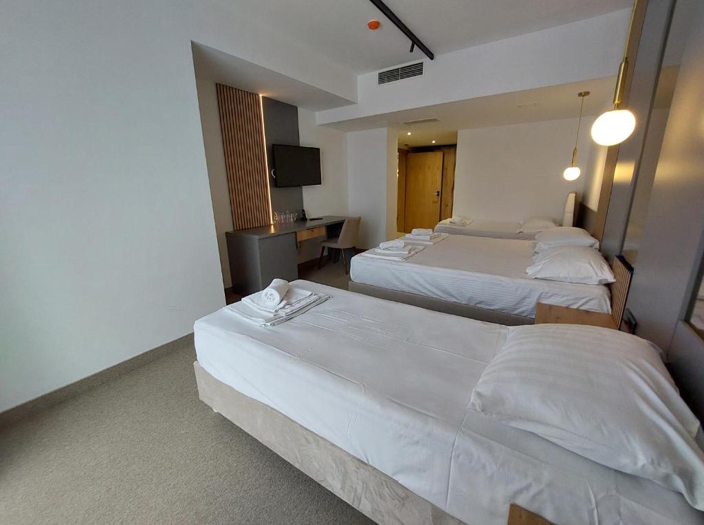 Postel nebo postele na pokoji v ubytování Hotel Almanas