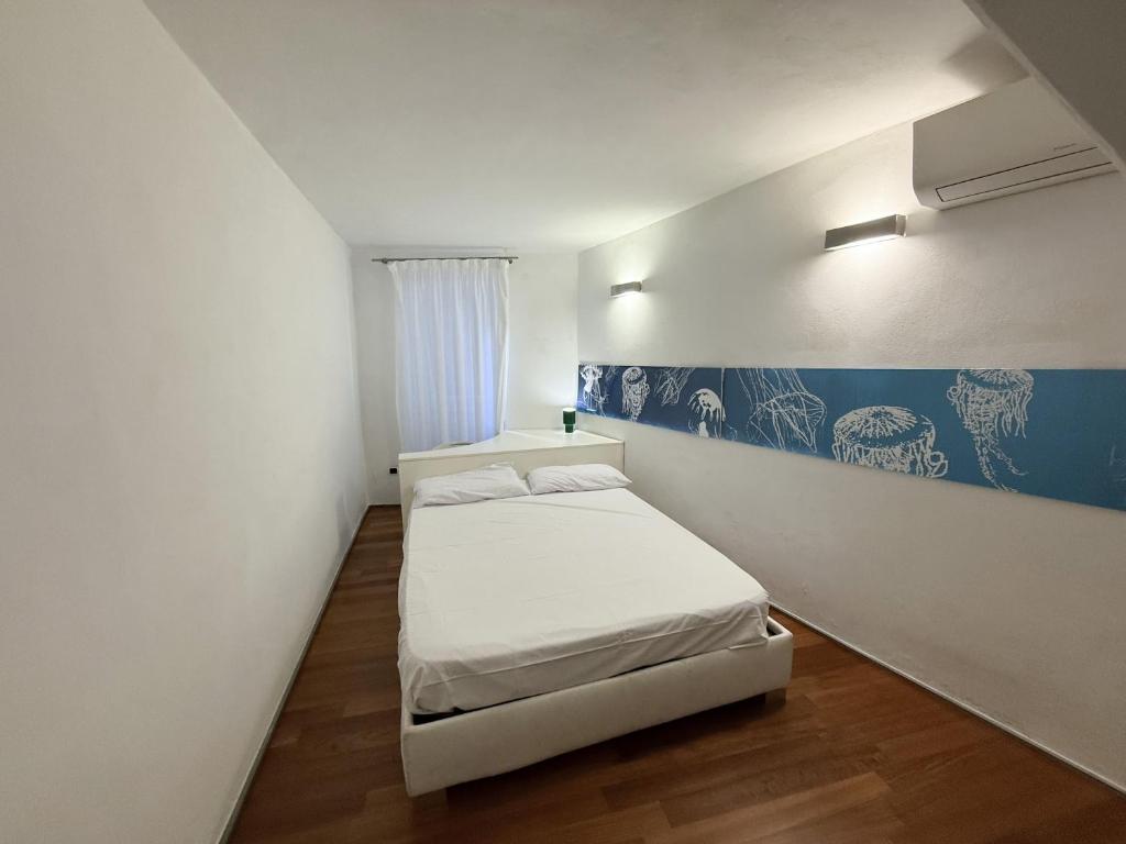 Postel nebo postele na pokoji v ubytování Mare Mosso 2