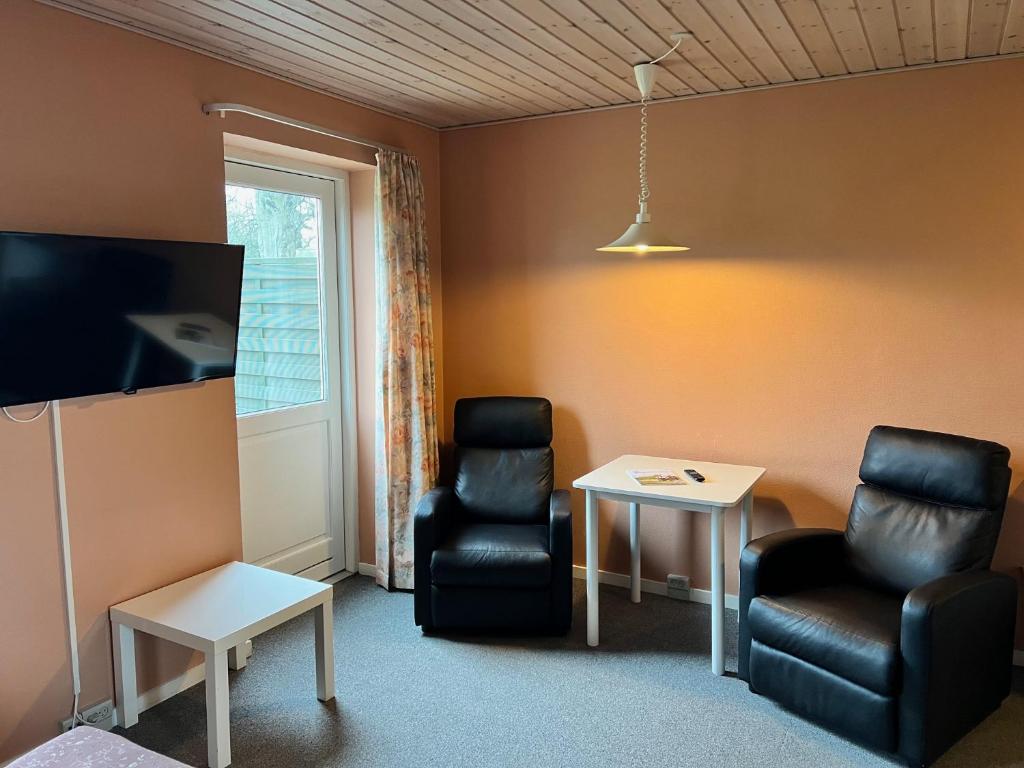 TV a/nebo společenská místnost v ubytování Hotel Frøslev Kro
