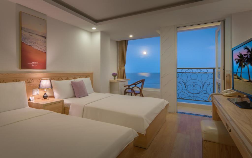 Giường trong phòng chung tại Nang Vang Hotel Nha Trang