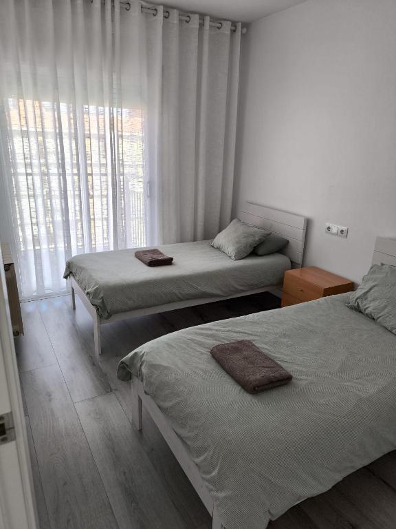 Posteľ alebo postele v izbe v ubytovaní Atico Condal