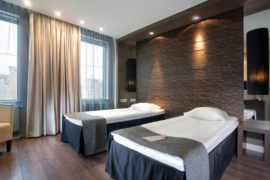 Postel nebo postele na pokoji v ubytování Tallink Hotel Riga