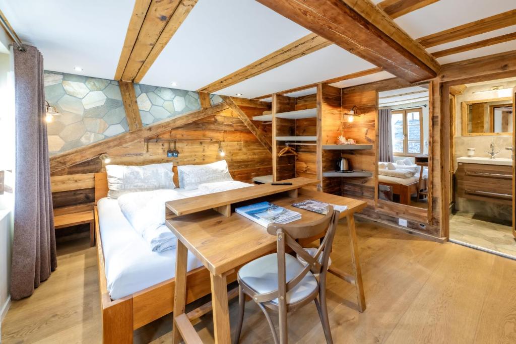 Postel nebo postele na pokoji v ubytování Hotel de la Croix-Fédérale