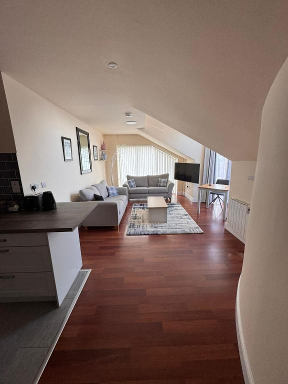 a living room with a couch and a table at Washington Street Apartment in Cork