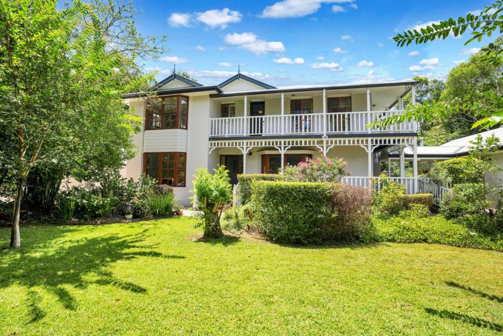 an exterior view of a large house with a yard at The Avenue at Montville (House) in Montville