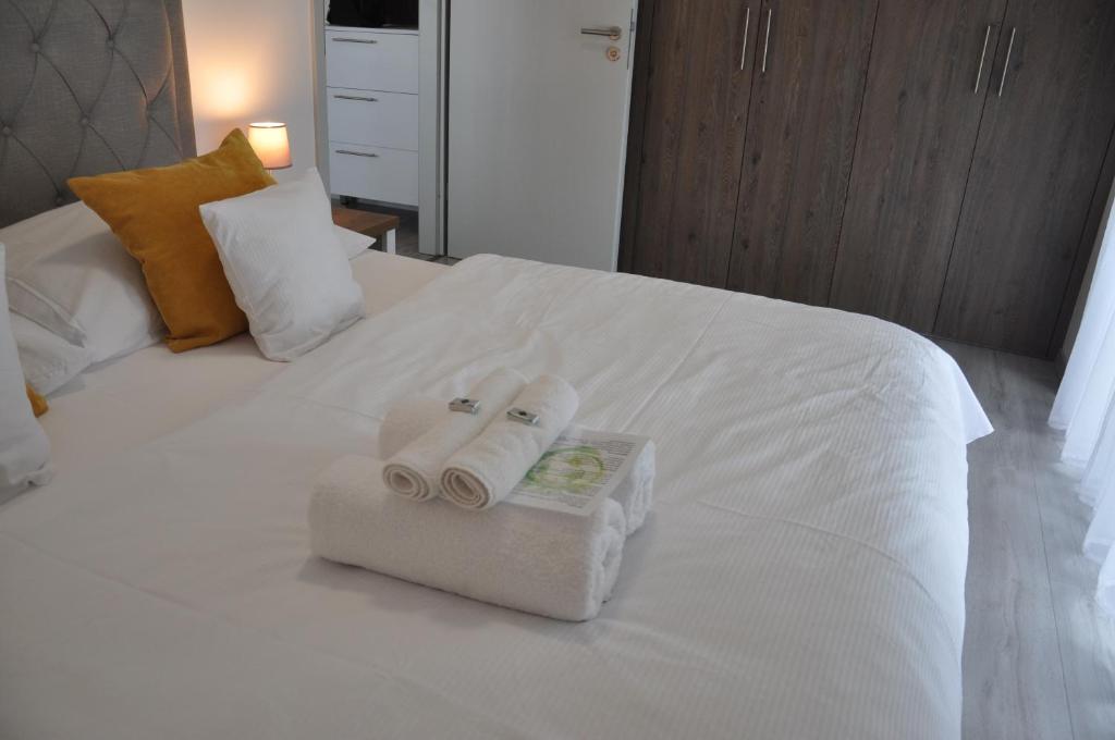 Postel nebo postele na pokoji v ubytování Magnolia Apartman