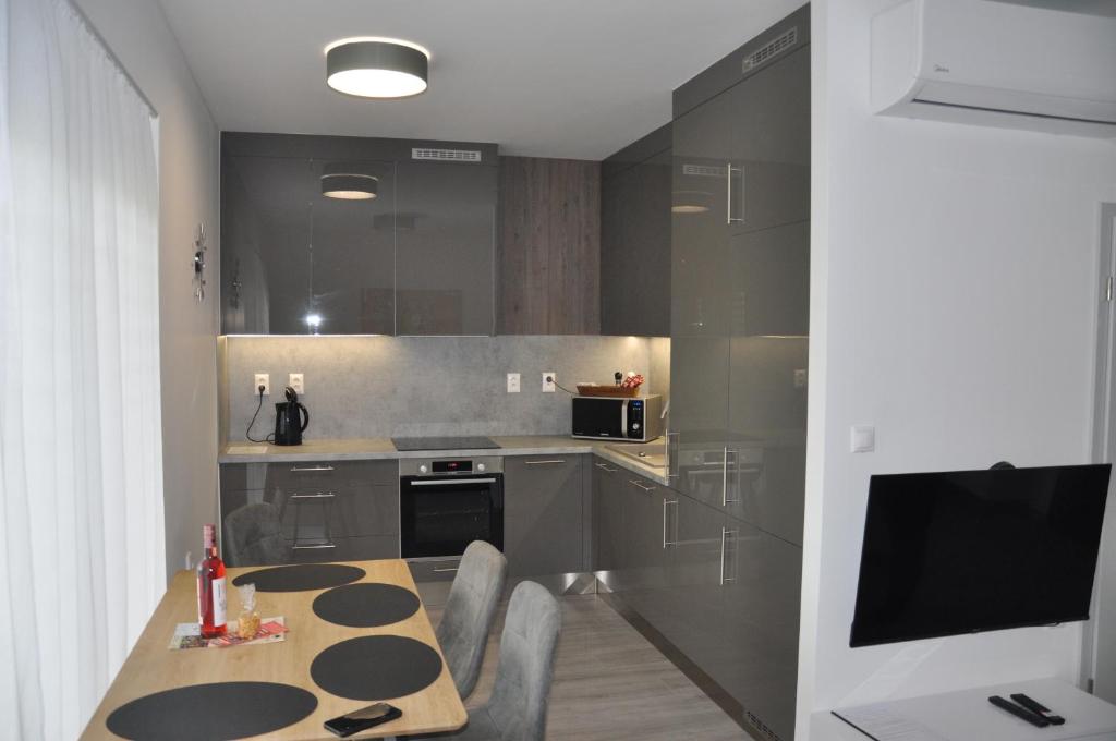 Kuchyň nebo kuchyňský kout v ubytování Magnolia Apartman