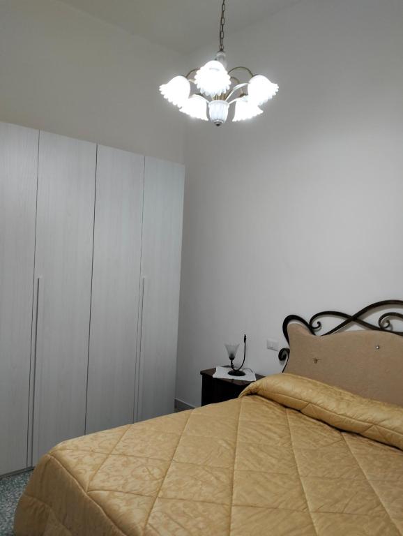 Postel nebo postele na pokoji v ubytování Orchidea