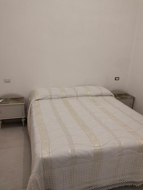 Postel nebo postele na pokoji v ubytování Orchidea