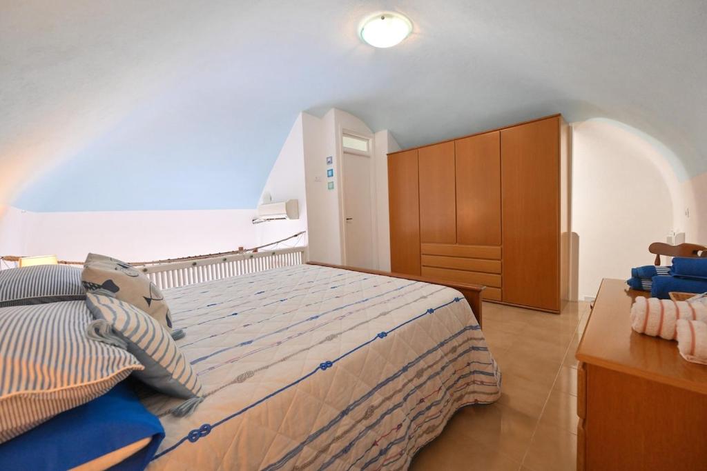 Letto o letti in una camera di Beach House Ischia