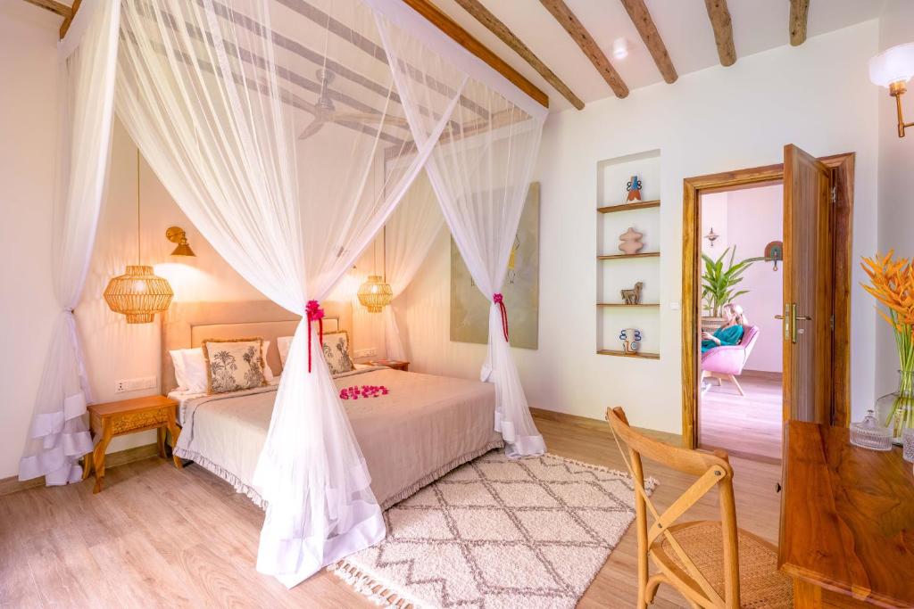 Postel nebo postele na pokoji v ubytování Zanzi Resort Private Paradise