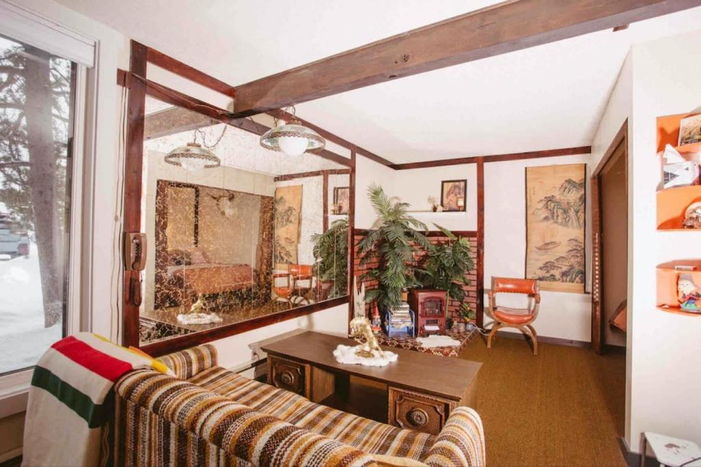 a living room with a couch and a table at Innsbruck Walkable to Big Sky Resort in Big Sky