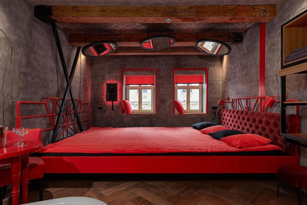 Postel nebo postele na pokoji v ubytování Masoch. Hotel & Cafe