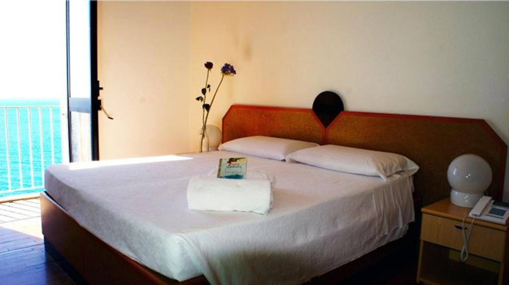 Postel nebo postele na pokoji v ubytování Albergo Palazzo