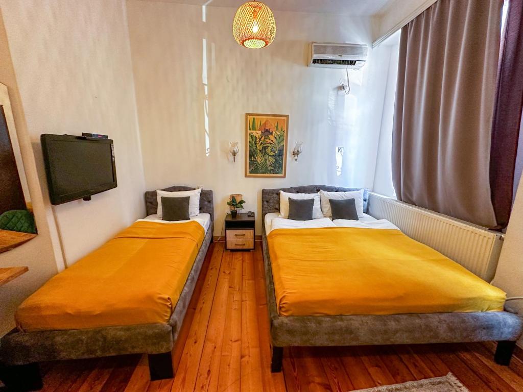 Postel nebo postele na pokoji v ubytování The Only One Apartments