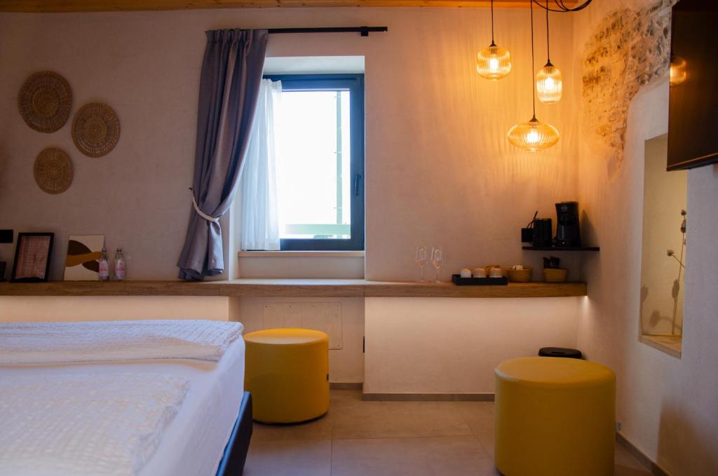 Postel nebo postele na pokoji v ubytování Stella D'Oro - Hotel & Apartments