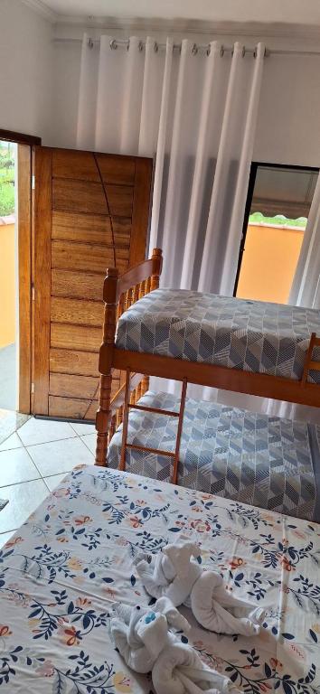 Postel nebo postele na pokoji v ubytování Hospedagem Familiar Yamane