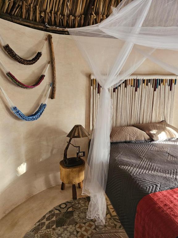 Postel nebo postele na pokoji v ubytování Cabaña Los Gallitos Ecolodge