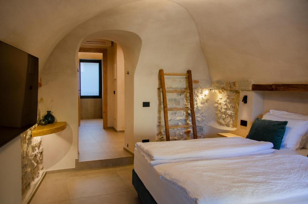 Postel nebo postele na pokoji v ubytování Stella D'Oro - Hotel & Apartments