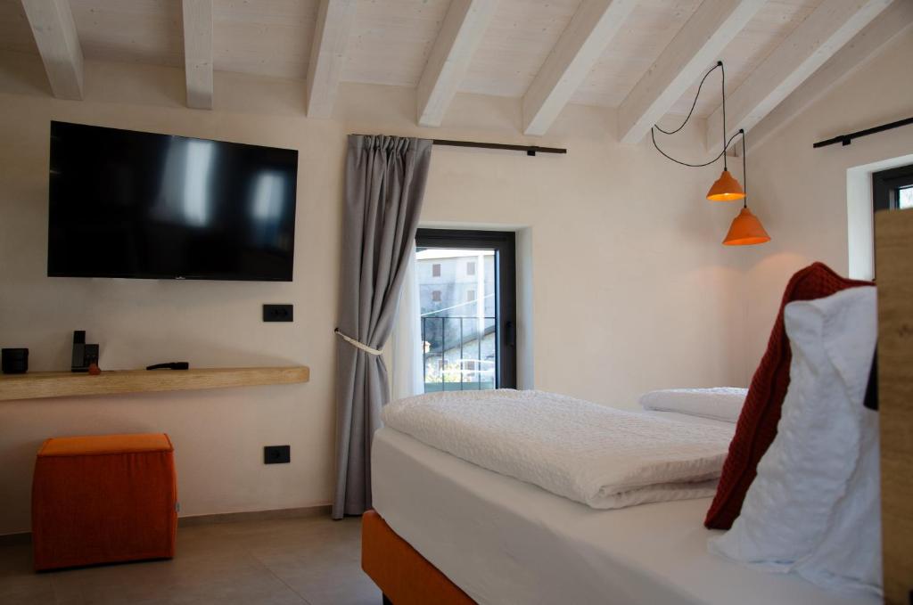 Postel nebo postele na pokoji v ubytování Stella D'Oro - Hotel & Apartments