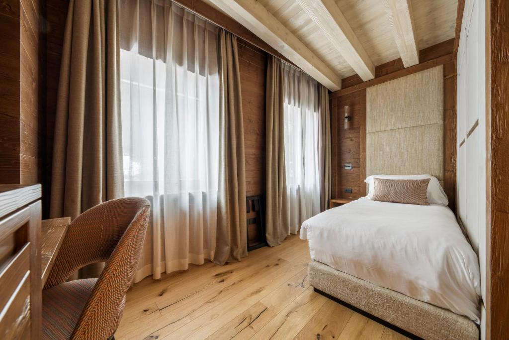 Postel nebo postele na pokoji v ubytování Casa Guargnè