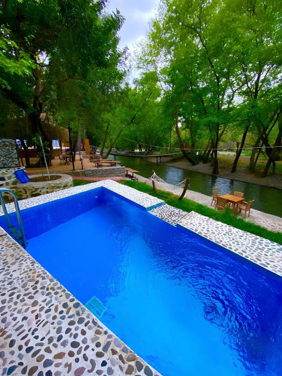 Bazén v ubytování Gizli Cennet Villages Hotel nebo v jeho okolí